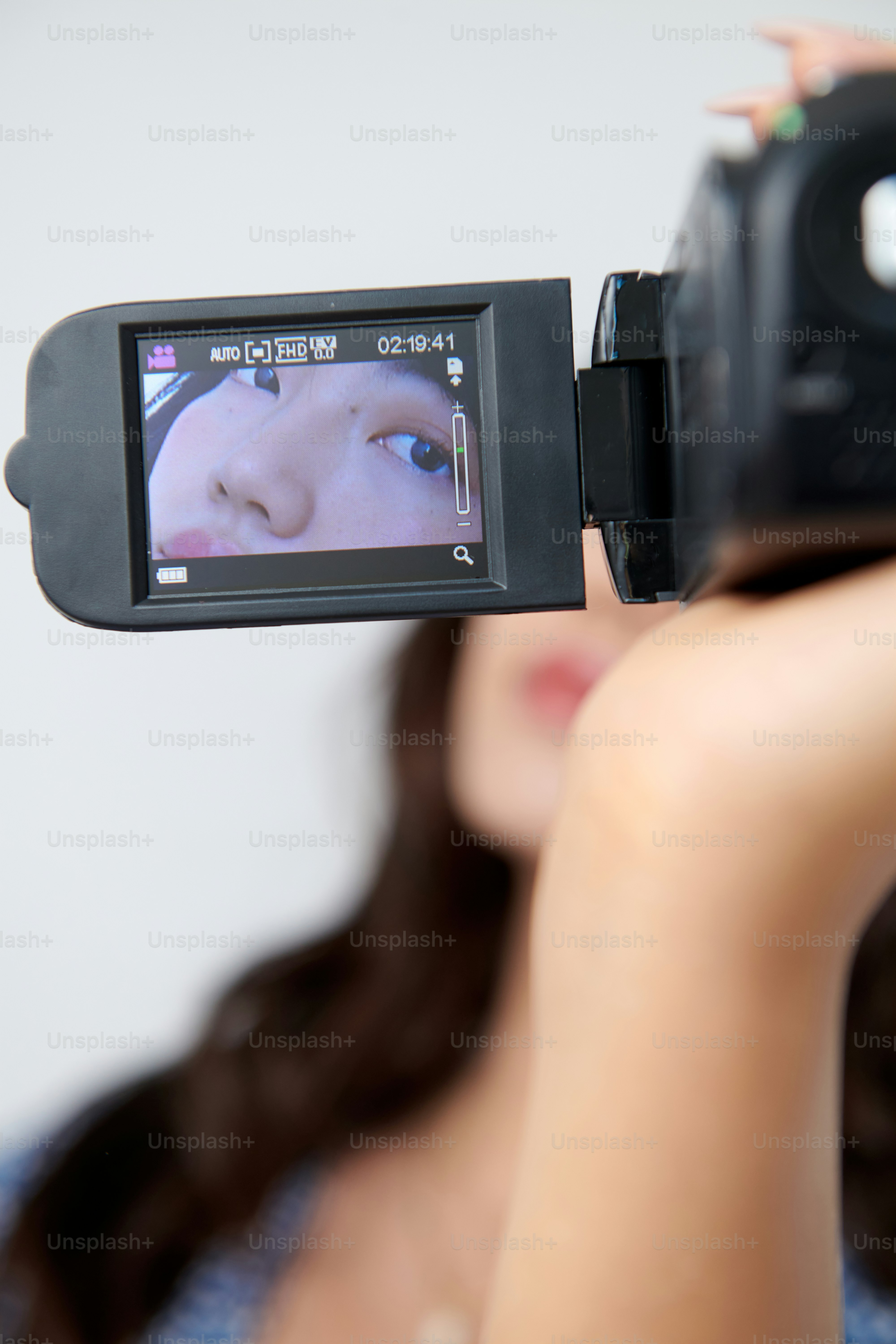 A woman taking a picture of herself with a camera